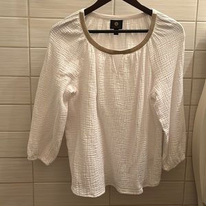 A pretty metallic ribbon adds shine and elevated finish to this beautiful top